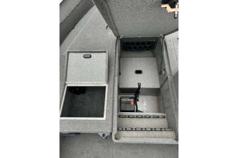 Slide: The Image of 2015 Lund 1775 Impact boat storage compartments with battery charger and rod holders. - 30