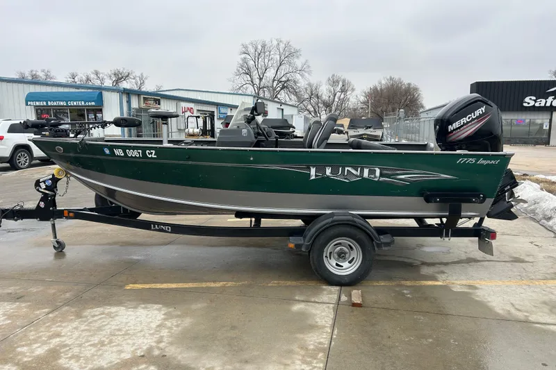 Slide: The Image of 2015 Lund 1775 Impact fishing boat on trailer, parked outside dealership. - 4