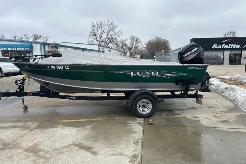 Slide: The Image of 2015 Lund 1775 Impact boat on trailer, covered, parked outdoors. - 5