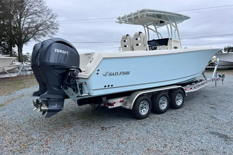 Slide: The Image of 2024 Sailfish 290 CC boat interior with seating and storage compartments. - 12