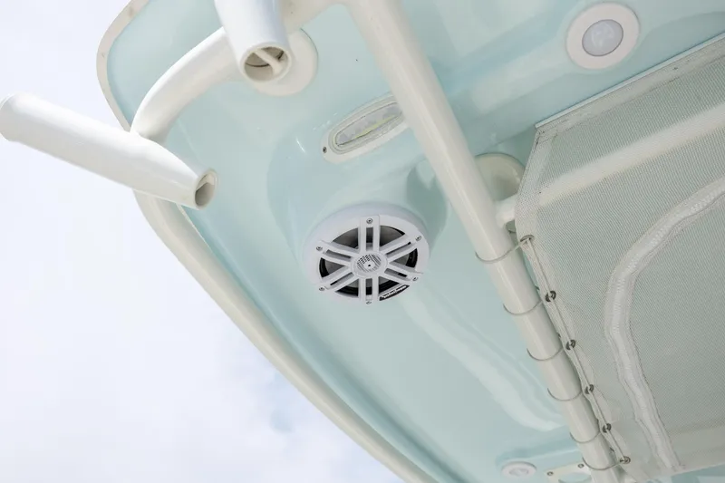 Slide: The Image of 2024 Sailfish 290 CC boat detail showing speaker and rod holders. - 16