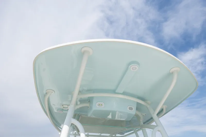 Slide: The Image of 2024 Sailfish 290 CC boat canopy against a blue sky. - 27