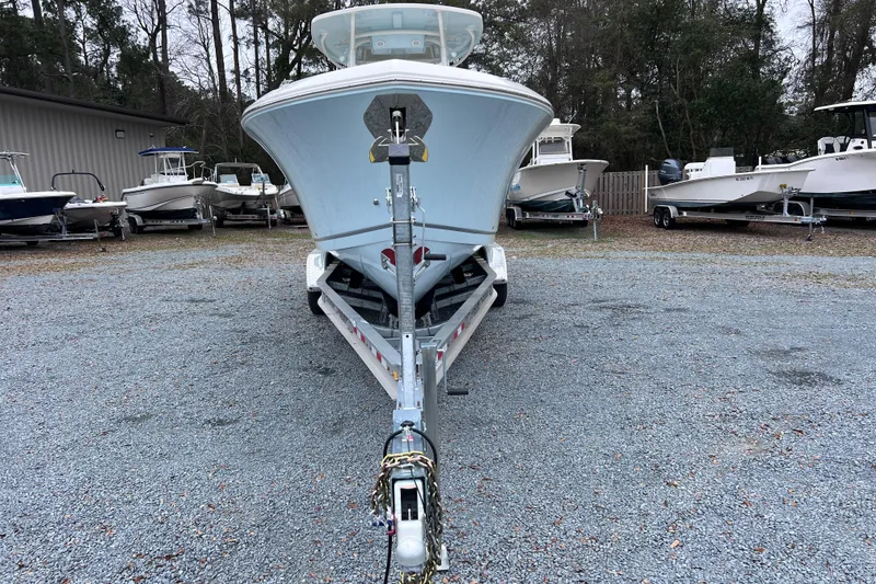 Slide: The Image of 2024 Sailfish 290 CC boat interior with dual captain's chairs and steering wheel. - 9