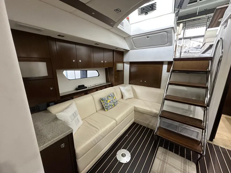 Slide: The Image of Luxurious interior of 2012 Cruisers Yachts 48 Cantius with elegant seating and wooden accents. - 12