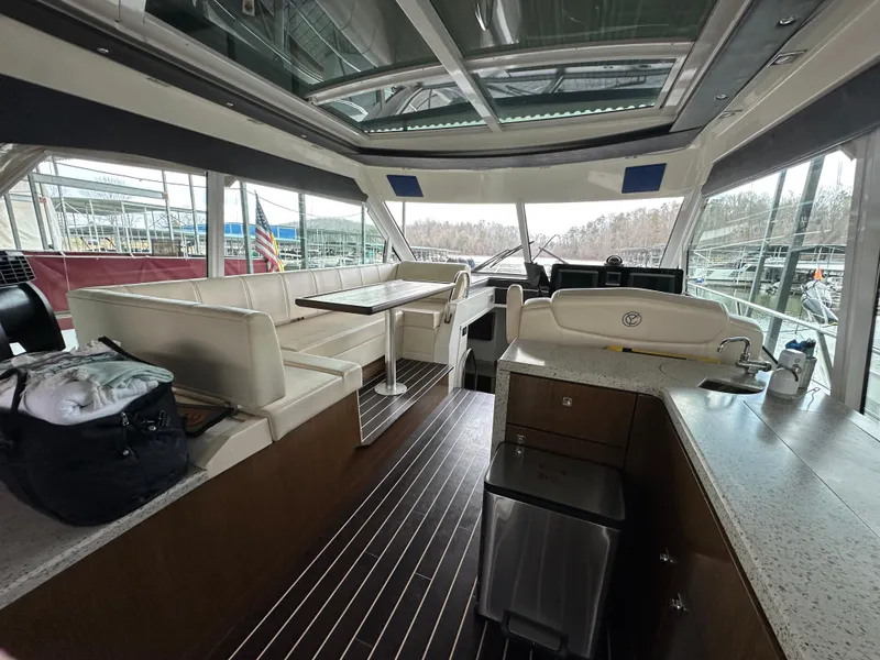 Slide: The Image of Interior of 2012 Cruisers Yachts 48 Cantius with seating and helm station. - 19