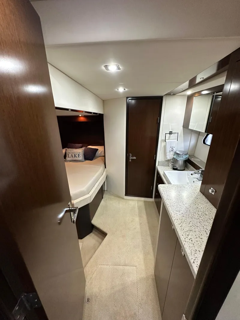 Slide: The Image of Interior of 2012 Cruisers Yachts 48 Cantius, featuring a cozy cabin and modern amenities. - 13