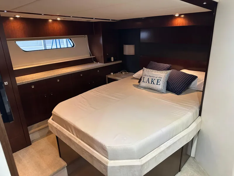 Slide: The Image of Luxurious bedroom interior of 2012 Cruisers Yachts 48 Cantius with elegant wood finishes. - 16