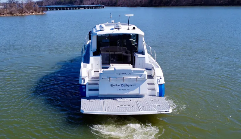 Slide: The Image of 2012 Cruisers Yachts 48 Cantius on calm water, rear view. - 4