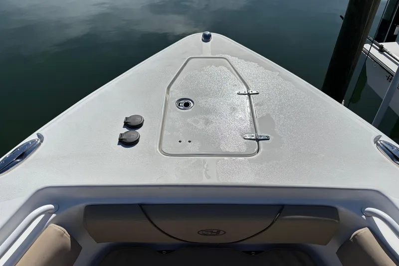 Slide: The Image of 2016 Sea Hunt Gamefish 27 boat bow with storage hatch and seating. - 23