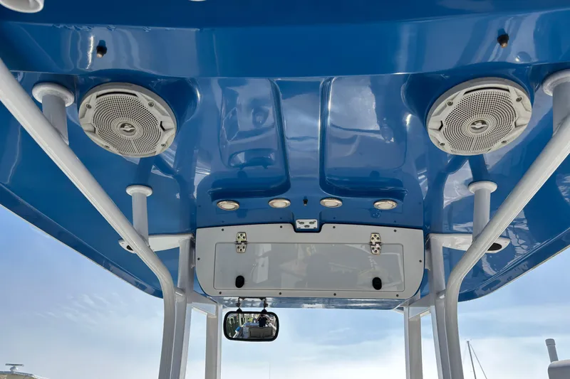 Slide: The Image of 2016 Sea Hunt Gamefish 27 boat roof with speakers and storage compartment. - 29