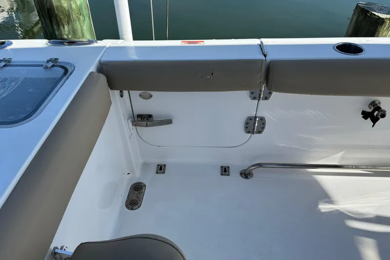 Slide: The Image of 2016 Sea Hunt Gamefish 27 boat interior with seating and storage compartments. - 31