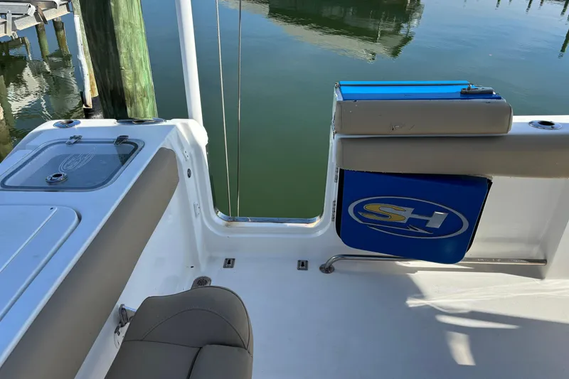 Slide: The Image of 2016 Sea Hunt Gamefish 27 boat interior with seating and storage compartments. - 32