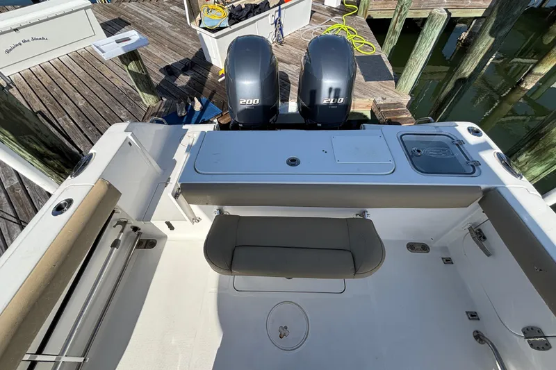 Slide: The Image of 2016 Sea Hunt Gamefish 27 boat with dual 200 horsepower engines at dock. - 6