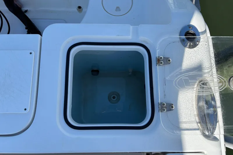 Slide: The Image of Livewell compartment on a 2016 Sea Hunt Gamefish 27 boat, open with clear lid. - 8