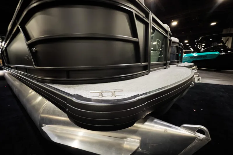 Slide: The Image of 2026 Godfrey Sweetwater 22' Split Bench Tritoon, sleek design, showcased indoors. - 14