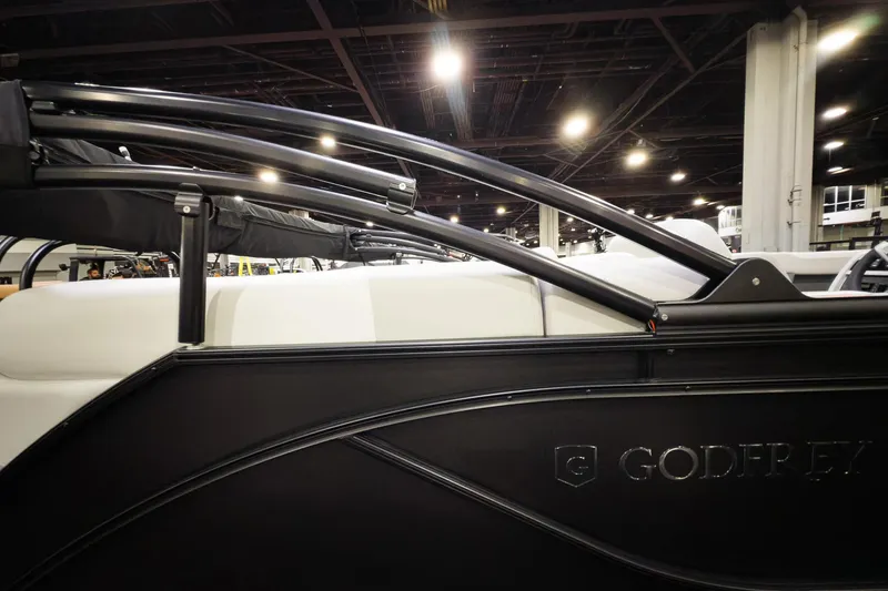 Slide: The Image of 2026 Godfrey Sweetwater 22' Split Bench Tritoon, sleek design, indoor display. - 15