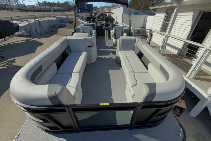 Slide: The Image of 2026 Godfrey Sweetwater 22' Split Bench Tritoon with spacious seating and modern design. - 25