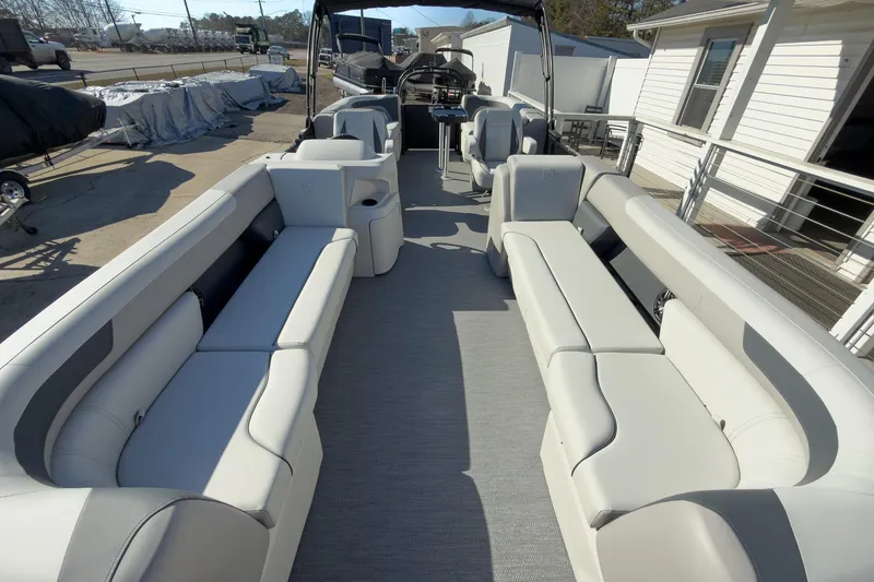 Slide: The Image of 2026 Godfrey Sweetwater 22' Split Bench Tritoon with spacious seating and modern design. - 28