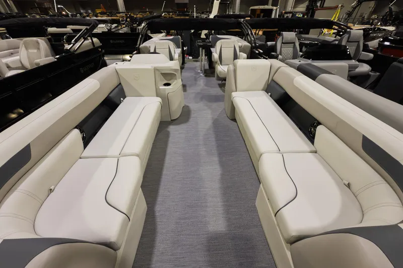 Slide: The Image of 2026 Godfrey Sweetwater 22' Split Bench Tritoon interior with spacious seating and modern design. - 3