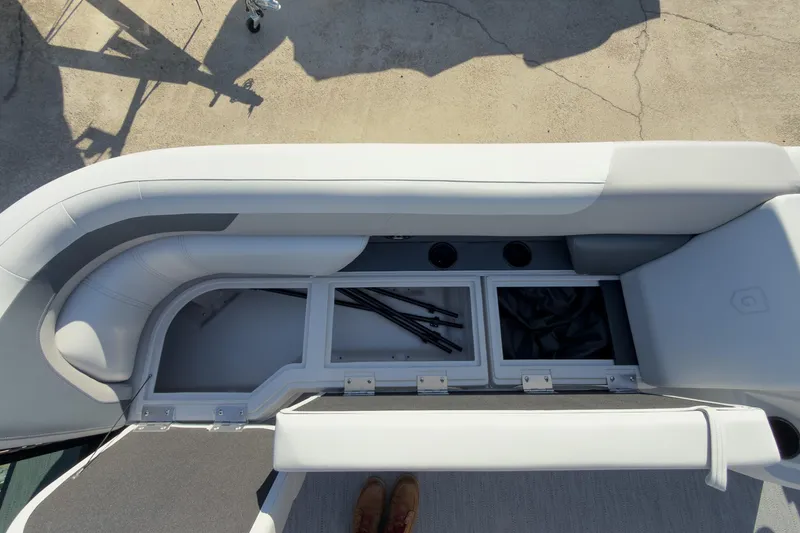 Slide: The Image of 2026 Godfrey Sweetwater 22' Tritoon storage compartments with seating, showcasing spacious design. - 32