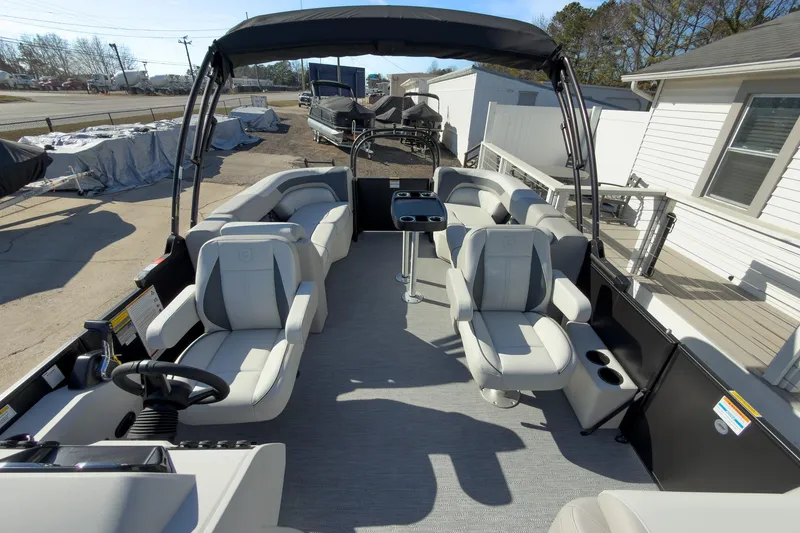 Slide: The Image of 2026 Godfrey Sweetwater 22' Split Bench Tritoon with spacious seating and modern design. - 36