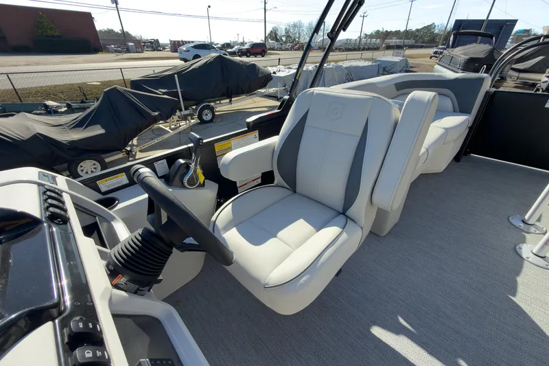 Slide: The Image of 2026 Godfrey Sweetwater 22' Tritoon interior with plush seating and modern helm. - 42