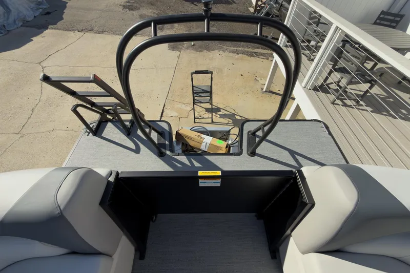 Slide: The Image of 2026 Godfrey Sweetwater 22' Tritoon rear deck with seating and ladder. - 50