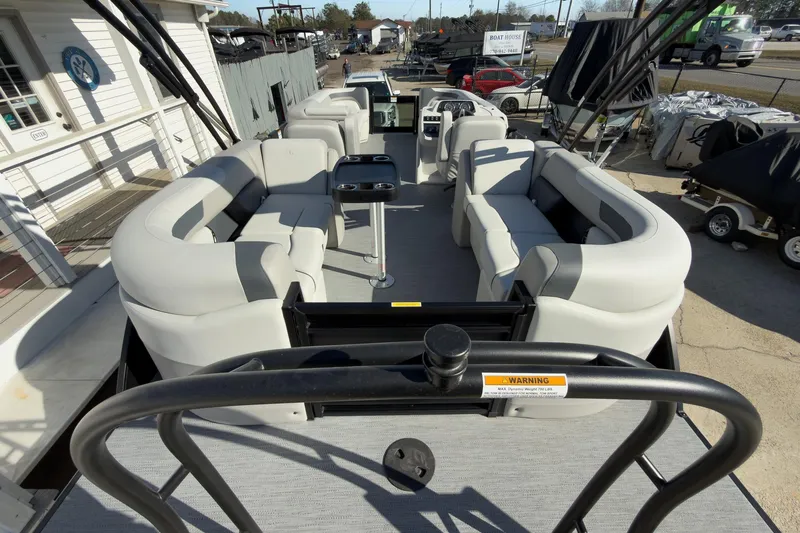 Slide: The Image of 2026 Godfrey Sweetwater 22' Split Bench Tritoon with spacious seating and modern design. - 51