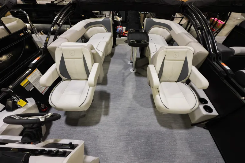 Slide: The Image of 2026 Godfrey Sweetwater 22' Split Bench Tritoon interior with luxurious seating and modern design. - 6
