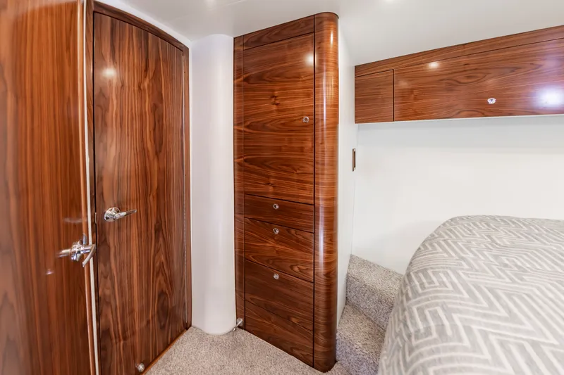 Slide: The Image of Interior of 2024 Albemarle Spencer Edition with wooden cabinetry. - 28