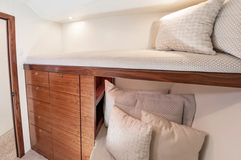 Slide: The Image of Interior of 2024 Albemarle Spencer Edition with wooden cabinets and bed. - 35