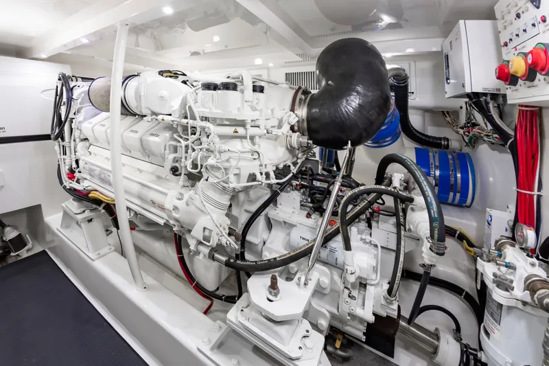 Slide: The Image of Engine room of 2024 Albemarle Spencer Edition boat, showcasing complex machinery. - 48