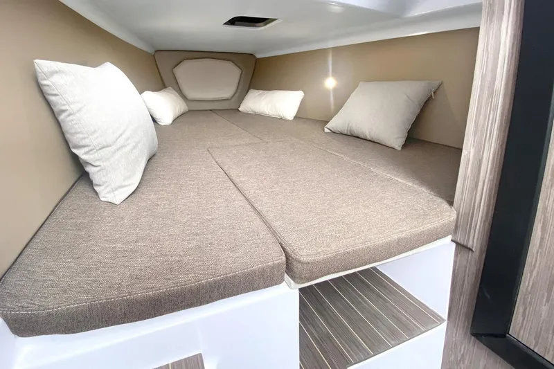 Slide: The Image of Interior cabin of 2026 Ranieri CAYMAN 28.0 EXECUTIVE with cozy bedding and pillows. - 3