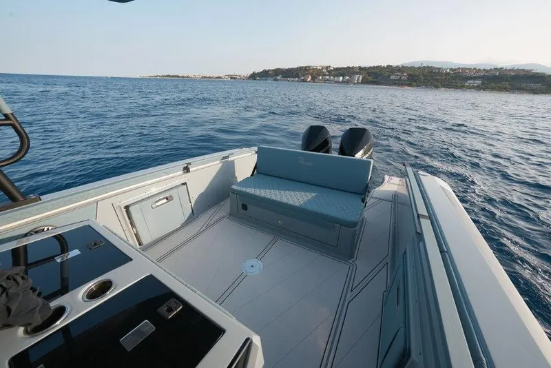 Slide: The Image of 2026 Ranieri CAYMAN 33.0 EXECUTIVE boat on open water, featuring sleek design and dual engines. - 24
