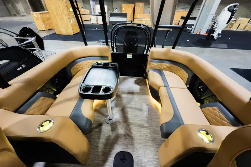 Slide: The Image of Luxurious interior of 2026 Godfrey Monaco 255 Sun Deck boat with plush seating and table. - 23