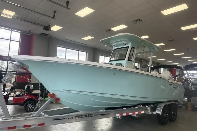 Slide: The Image of 2026 Key West 263 FS boat interior with seating and storage compartments. - 12