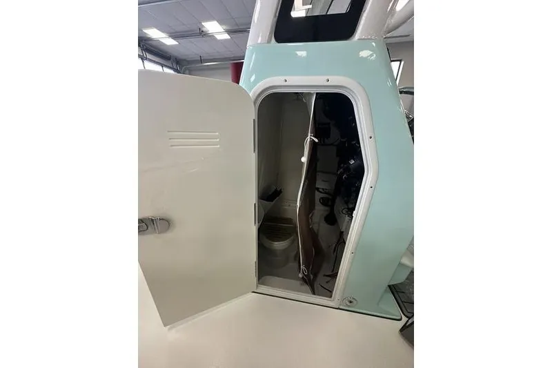 Slide: The Image of 2026 Key West 263 FS boat interior with cushioned seating and overhead speakers. - 16