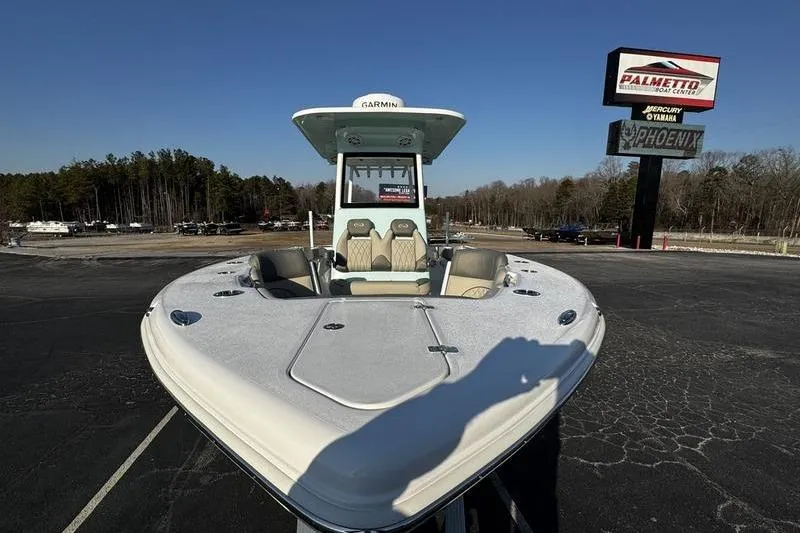 Slide: The Image of 2026 Key West 263 FS boat displayed at Palmetto Boat Center, clear sky background. - 2
