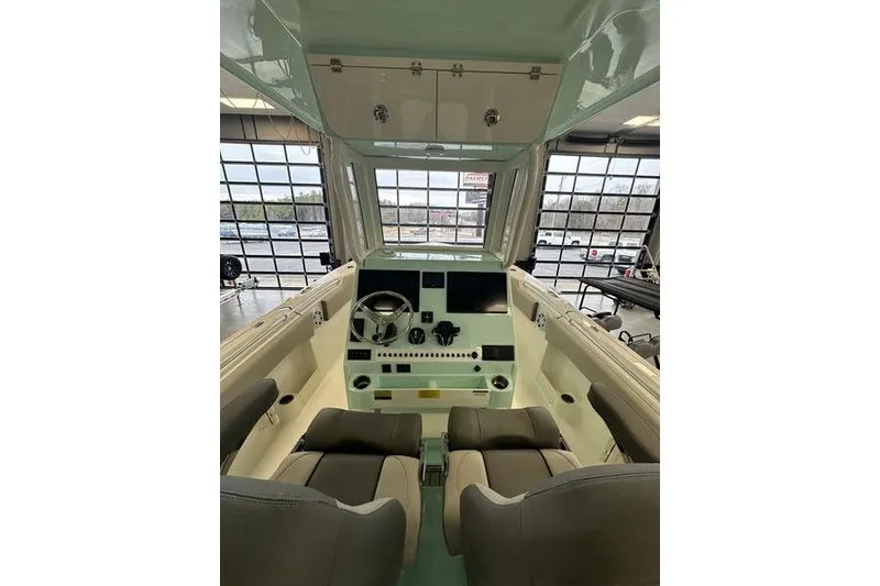 Slide: The Image of 2026 Key West 263 FS boat interior with dual engines and storage compartments. - 24