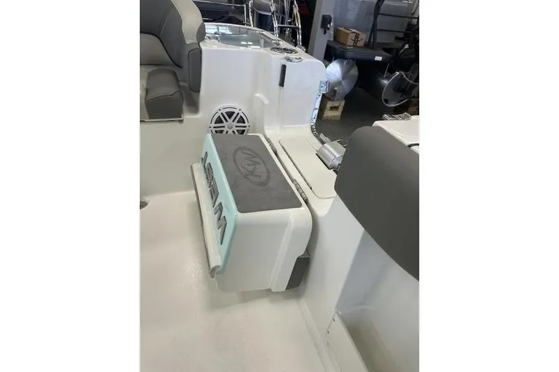 Slide: The Image of 2026 Key West 263 FS boat interior with seating and storage compartments. - 31