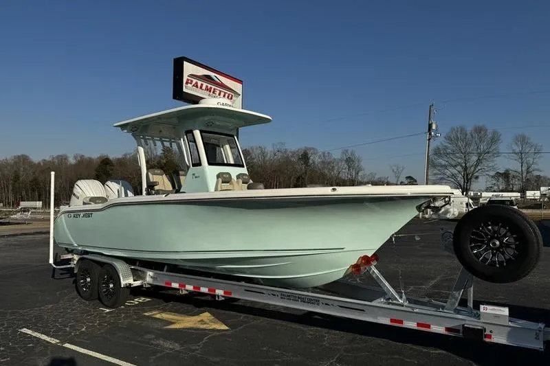 Slide: The Image of 2026 Key West 263 FS boat with Yamaha engine, rear view on pavement. - 6