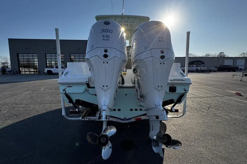 Slide: The Image of 2026 Key West 263 FS boat displayed indoors on a trailer. - 9