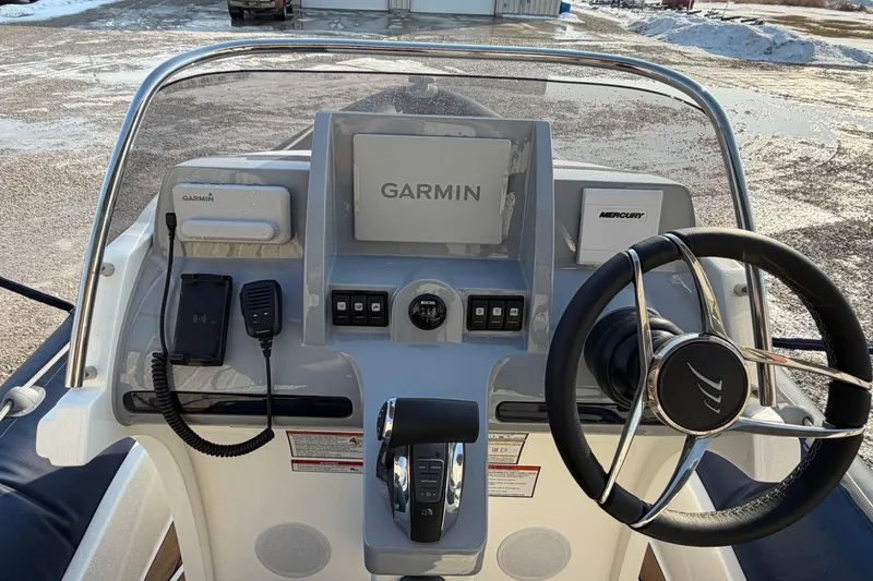 Slide: The Image of Cockpit of 2023 Cobra Ribs Nautique 7.0m with Garmin navigation and Mercury controls. - 9