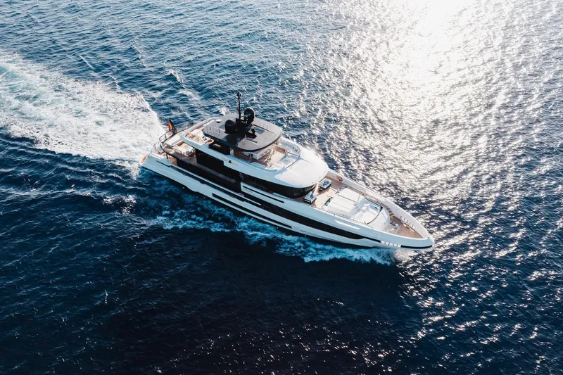 Slide: The Image of 2024 Mangusta Oceano 44 yacht cruising on open sea, aerial view. - 10