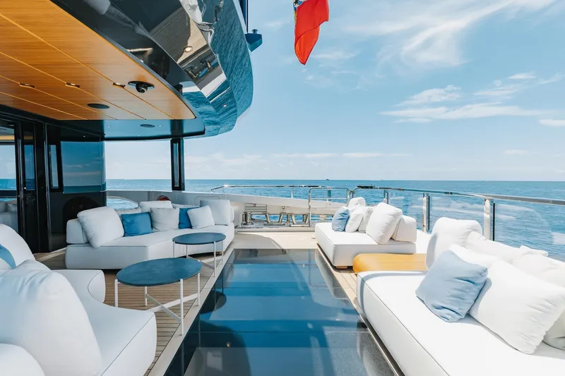 Slide: The Image of Luxurious 2024 Mangusta Oceano 44 yacht deck with plush seating and ocean view. - 12