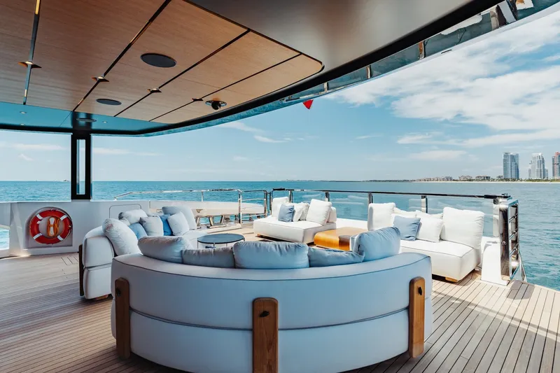 Slide: The Image of Luxurious 2024 Mangusta Oceano 44 yacht deck with plush seating and ocean view. - 13