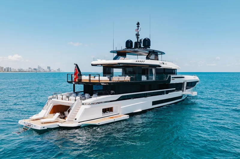 Slide: The Image of 2024 Mangusta Oceano 44 yacht cruising on open sea under clear blue sky. - 3