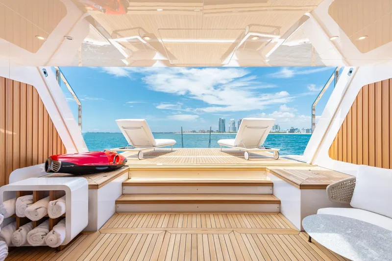 Slide: The Image of Luxurious 2024 Mangusta Oceano 44 yacht deck with sun loungers and ocean view. - 31
