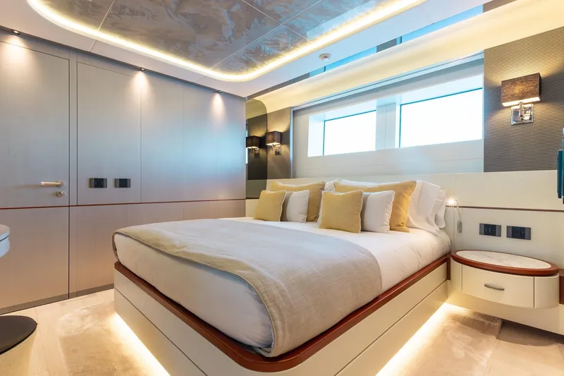 Slide: The Image of Luxurious bedroom interior of 2024 Mangusta Oceano 44 yacht, featuring modern design and ambient lighting. - 32