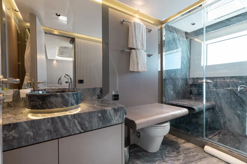 Slide: The Image of Luxurious bathroom in 2024 Mangusta Oceano 44 yacht with marble finishes and modern fixtures. - 37